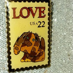 Highly collectible 22-cent stamp puppy lapel pin